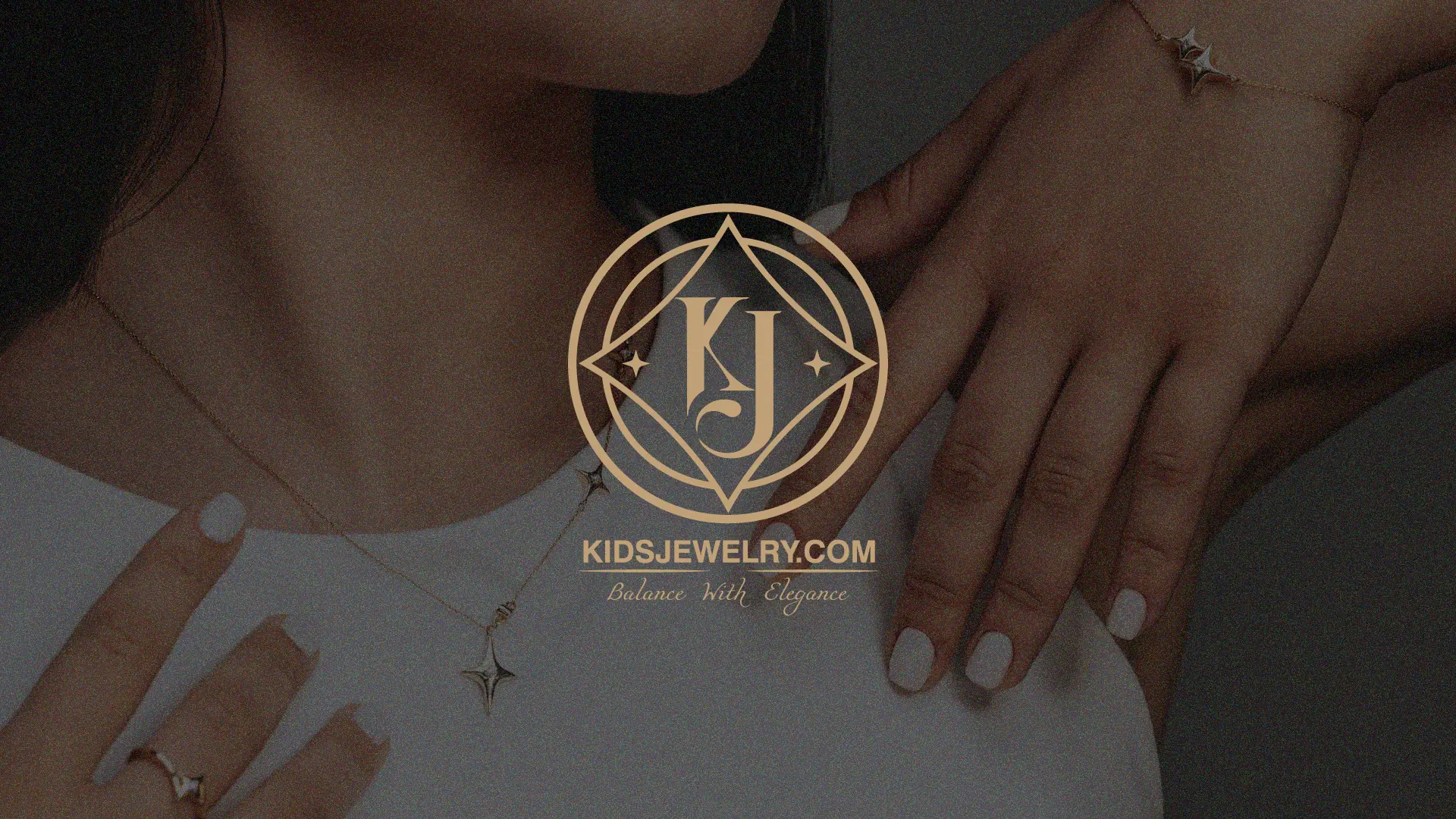 Kids Jewelry logo over a model wearing a gold star pendant necklace